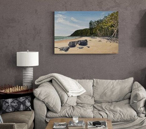 Tea Tree Bay Noosa National Park beach with coffee rocks, the ocean, sand, tea trees and sky.