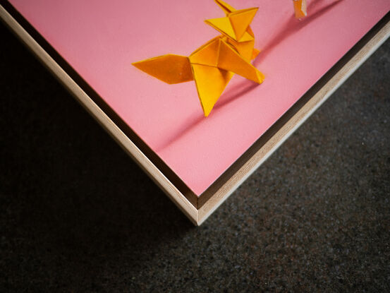 two origami foxes meeting under a hanging paper moon. the mood is fun and playful