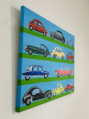 A painting of beautifully designed automobiles from the past.