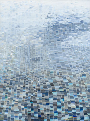 Water rippling over blue pool tiles.