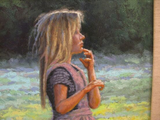 A young pioneer girl enjoying a cool summer breeze.