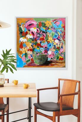 Coloured flowers in a vase on the kitchen table