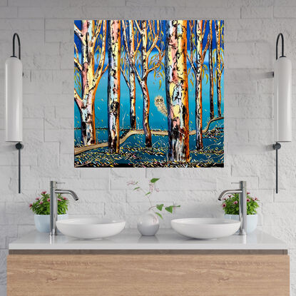 Several colourful gum tree trunks, an Emu looking out from behind  the trees with some leaf litter and twigs a lovely aqua blending upwards to bright blue sky 