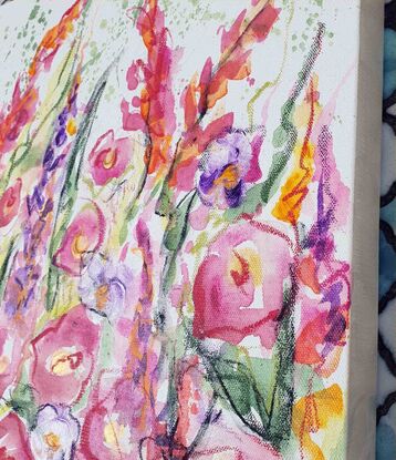 An abstract landscape of bright vivid flowers in pink, red, purple, orange, yellow and greens