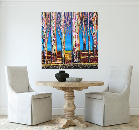 Several colourful gum tree trunks, a Kangaroo hiding in plain sight, with some leaf litter and twigs a lovely deep maroon with pops of green fading light blue upward to a bright blue sky 