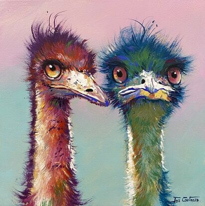 Two emus painted in reds and green and blue. 