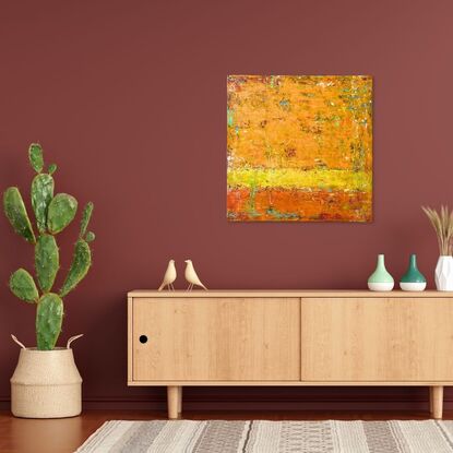 An orange and yellow layered abstract painting, with hints of complementary colours.