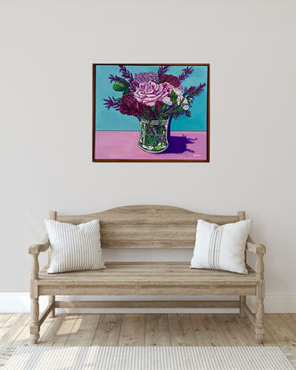 Bouquet of bright colourful flowers in a glass vase, with a teal and pink background, giving a true burst of colour to brighten any room and fill the atmosphere with joy.