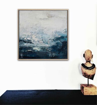 An ocean inspired textured small original painting in a moody predominantly deep blue and off white palette with a hint of silver