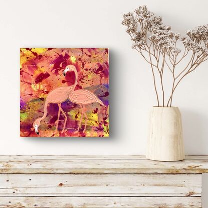 Textured orange flamingos on orange, yellow and purple background