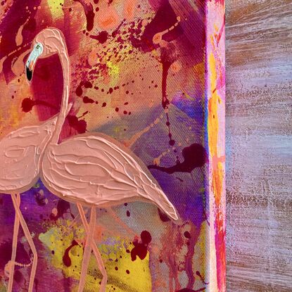 Textured orange flamingos on orange, yellow and purple background