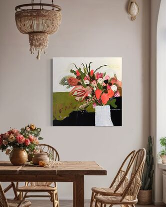 A bunch of bright orange and green flowers in a white textured vase