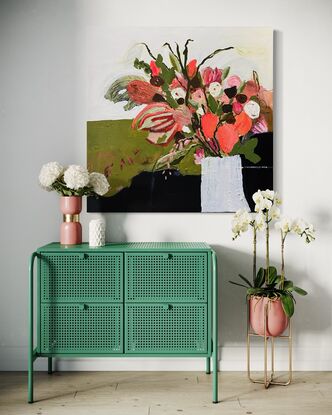 A bunch of bright orange and green flowers in a white textured vase