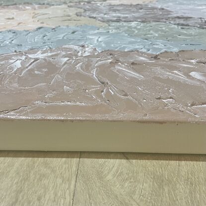 Thick clouds of lightweight plaster overlap each other to created a cloud-like affect. Each cloud is in a shade of peach, lilac, violet, blue, green, mustard or pink.