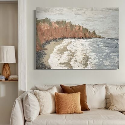 Palette knife seascape with clay coloured cliffs, dusty blue water and white waves reaching the shore.