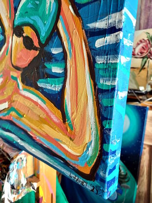 A woman in abstract way on a beach towel 