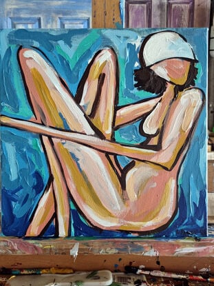 A woman in abstract way on a beach towel 