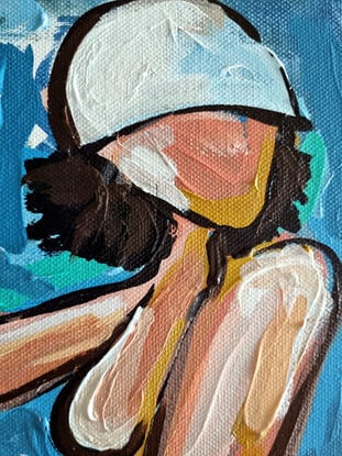 A woman in abstract way on a beach towel 