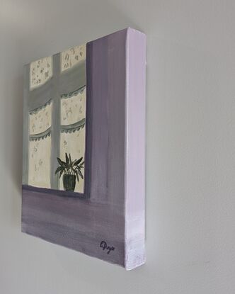 A shadow of an interior kitchen windowsill and curtain that casts a pot plant shadow against a purple interior wall. 