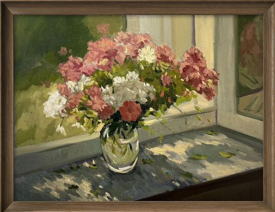 Pink and white flowers on windowsill