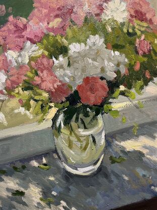 Pink and white flowers on windowsill