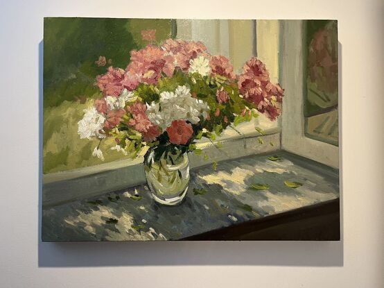 Pink and white flowers on windowsill