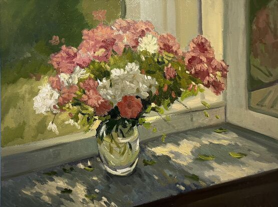 Pink and white flowers on windowsill