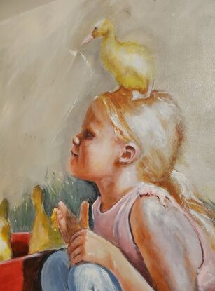 Girl with fluffy ducks on farm