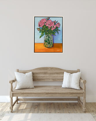 Pink roses in a glass vase, painted in a bright popart/cartoon  style with bright, cheerful light blue ax orange background. Realistic but with a slight cartoon twist in the bright colours and bold outlines. 
Set in a white timber frame that makes the bright colours pop. 