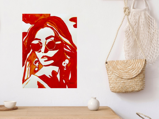 This striking artwork captures the essence of bold style and confidence. Rendered in rich shades of red and orange, the subject exudes an air of effortless sophistication. The minimalist composition emphasizes the stylish sunglasses and elegant earrings, creating a powerful visual statement that speaks to the subject's self-assured presence. This piece is a celebration of modern fashion and the timeless allure of confident femininity.