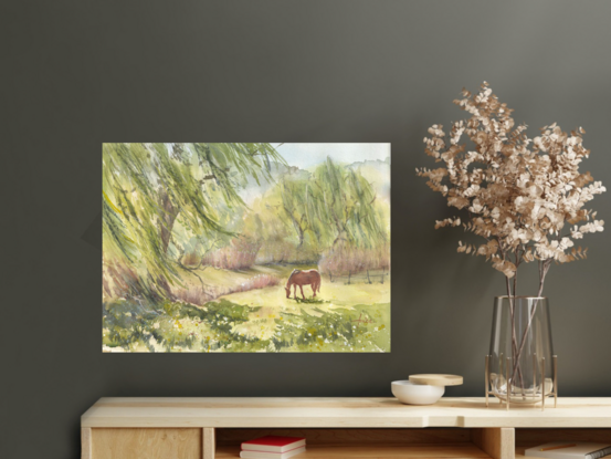 Serene scene of a horse grazing alongside a creek with Willow Trees either side, and with the biggest one in the front left hand corner.