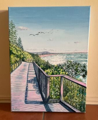 Beach boardwalk along the coast, framed by pandanus and coastal shrubs, seagulls overhead and views in distance,