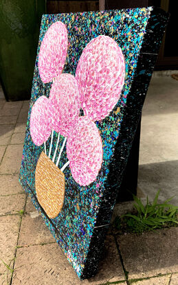 textured pink flowers in a metallic gold textured vase on a starry night background