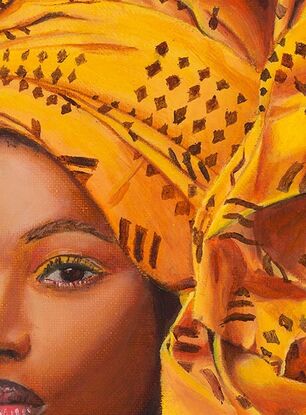 Portrait of an African woman with a yellow head scarf
