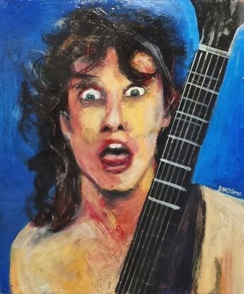 Angus Young from ACDC in his younger better looking days