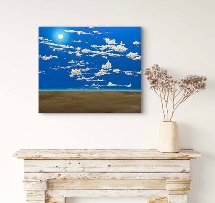 Blue night sky with intricate cloud formations and stars. Desert landscape of brown tones.