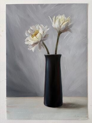 Still life with white flowers and black vase