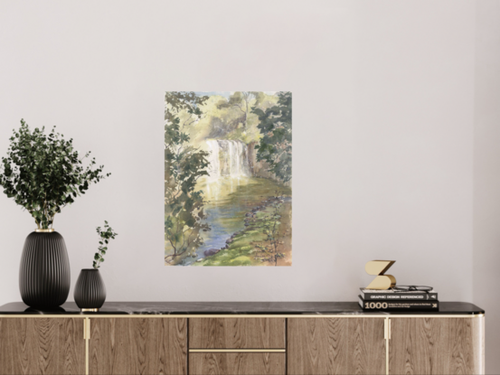 Waterfall in sunlight and shade with surrounding trees and rocks