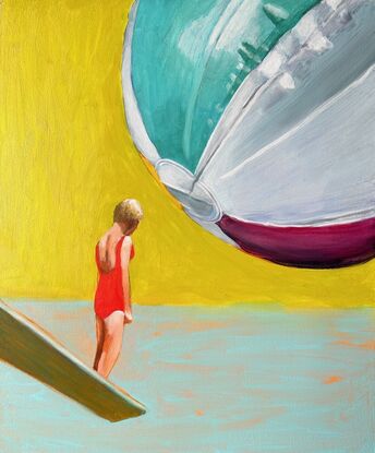 A woman stands on a diving board as a giant beachball looms above her.