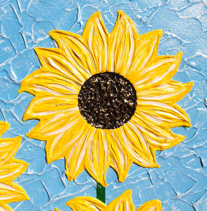 yellow textured sunflowers on a sky blue background textured abstract