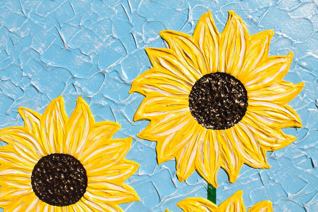 yellow textured sunflowers on a sky blue background textured abstract