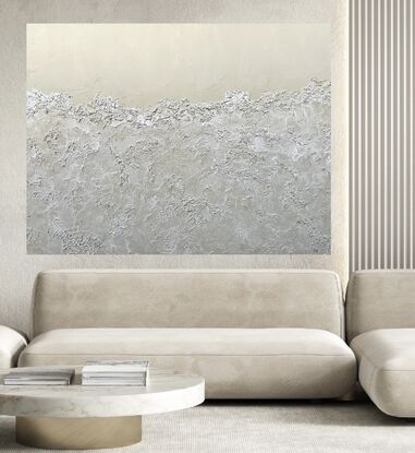 A neutral beige background with the bottom 3/4 covered with semi-transparent textured sea foam.