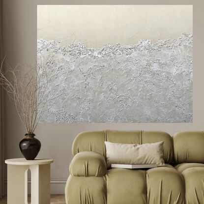 A neutral beige background with the bottom 3/4 covered with semi-transparent textured sea foam.