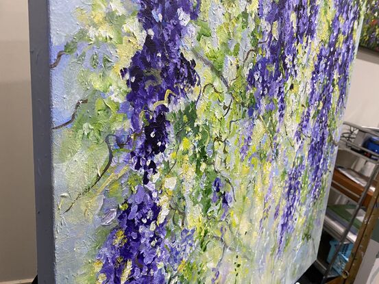 Cascades of soft mauve , lavender and purple flowers glistening with dew and sparkling in the soft morning light. Delicate green fronds and soft pockets of light enhance the beauty of the hanging flowers. A romantic, dreamy piece with the influence of Monet and the Impressionists. 