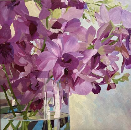 Purple Singapore Orchids in glass vase with reflections