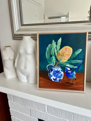 Blue fairy wren and banksia in a vase. 