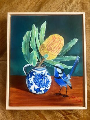 Blue fairy wren and banksia in a vase. 