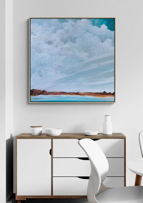 Fresh Textured cloudscape with crisp white clouds over teal blue sky overlooking rugged terrain in tan and burnt orange tones with fresh blue water inlet flowing across the canvas.
