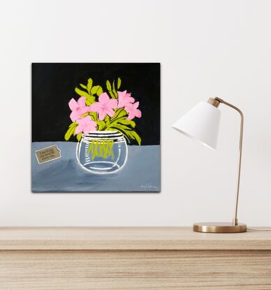 Pink flowers with green leaves in a glass vase against a dark paynes grey and light paynes grey background sides are painted to match