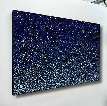 thousands of blue dots on black canvas